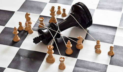 White chess pieces bring down Black King